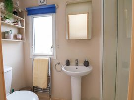 A bathroom with a sink and toilet at 15 Cherry Tree walk in Rhyl