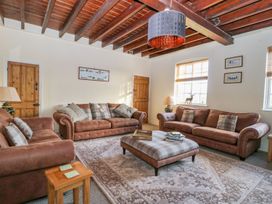 A living room with sofas and a coffee table at Tuft House in Hovingham