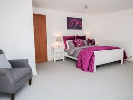 A bedroom with a bed and bedside table at Tuft House in Hovingham