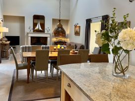 A dining room with a table and chairs at The Chimney in Bamburgh