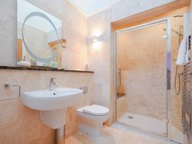 A bathroom with a sink and shower at The Chimney in Bamburgh