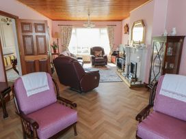 A living room with sofas and a fireplace at Marie's Country Home in Ardee, County Louth