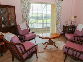 A living room with armchairs and a table at Marie's Country Home in Ardee, County Louth