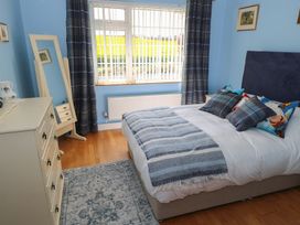 A bedroom with a bed and a window at Marie's Country Home, Ardee, County Louth