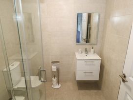 A bathroom with a shower, sink, and toilet at Marie's Country Home in Ardee, County Louth