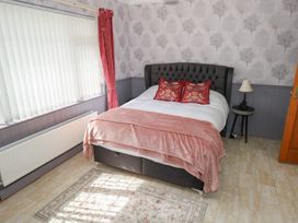 A bedroom with a bed and lamp at Marie's Country Home, Ardee, County Louth