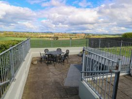An outdoor seating area with a table and chairs at Marie's Country Home in Ardee, County Louth