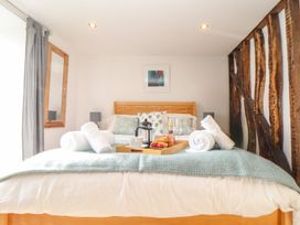 A bedroom with a bed and breakfast tray at Ty Bryn in Marazion