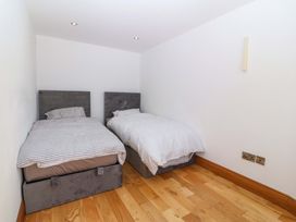 A bedroom with two beds at Apartment 1, Bryn Mel Manor in Menai Bridge