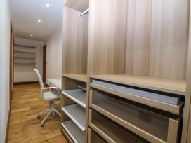 An office with a desk and shelves at Apartment 1, Bryn Mel Manor in Menai Bridge