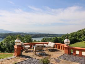 An outdoor patio with seating and a view at Apartment 1, Bryn Mel Manor in Menai Bridge