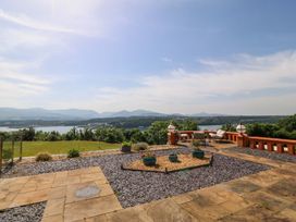 An outdoor view with a lake and mountains at Apartment 1, Bryn Mel Manor Menai Bridge