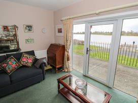 A living room with lake view and furniture at Sweetbriar Lodge Castlerea