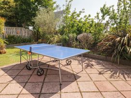 A ping pong table on a patio in the garden at 1 Rosemount Garden Villas Tenby