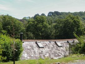 A roof with skylights and a chimney at The Mill Barn in Lustleigh