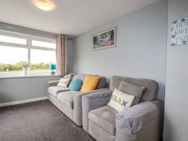 A living room with a sofa and window at Moorland View in Belowda near Roche