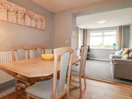 A dining room with a table and chairs at Moorland View Belowda near Roche