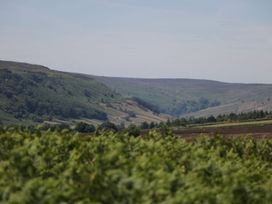 A landscape with hills and trees at Cosy Cocoon in Malton