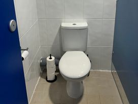 A bathroom with a toilet and toilet paper at Cosy Cocoon near Rillington
