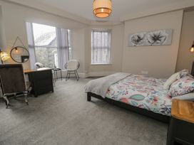 A bedroom with bed and desk at Llety Cllyd in Barmouth