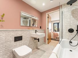 A bathroom with a sink and a bathtub at Clifftop House Hot Tub in St Ives