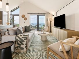 A living room with a sofa and table at tbc in St. Ives