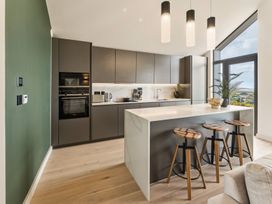 A kitchen with cabinets and a countertop at tbc in St. Ives