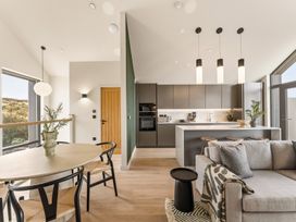 A kitchen with a dining table and sofa at tbc in St. Ives