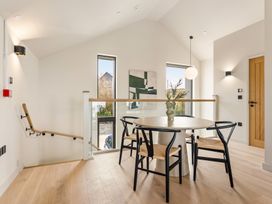 A dining room with a table and chairs at tbc in St. Ives