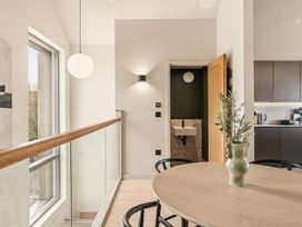 A kitchen with a table and chairs at tbc in St. Ives
