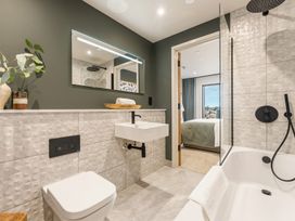 A bathroom with a sink, toilet, and shower at tbc in St. Ives