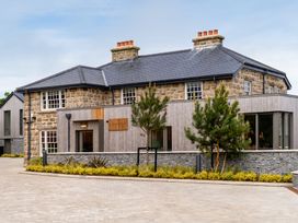 A house with stone and wooden features at Hidden 2- Bay House Hot Tub St Ives