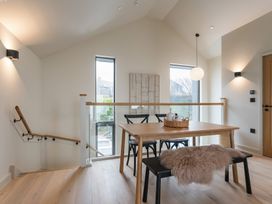 A dining room with a table and chairs at tbc in St. Ives