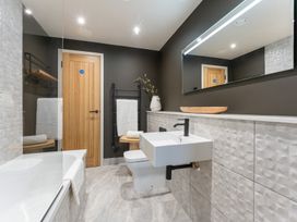 A bathroom with a sink and a bathtub at tbc in St. Ives