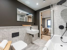 A bathroom with a sink, toilet, and shower at tbc in St. Ives