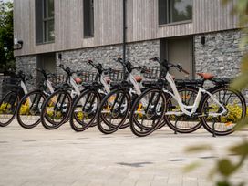 A row of bicycles parked outside a building at Hidden 3- Sea Terrace House in St Ives