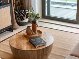 A living room with a coffee table and plants at tbc in St. Ives