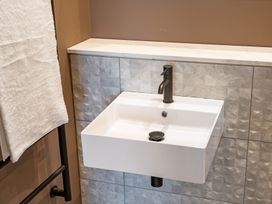 A sink with a faucet and a towel at tbc St. Ives