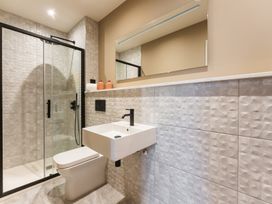 A bathroom with a shower, sink and toilet at tbc in St. Ives