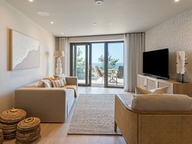 A living room with a television and a sofa at tbc in St. Ives