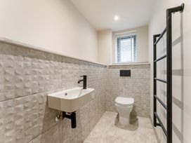 A bathroom with a sink and toilet at tbc in St. Ives