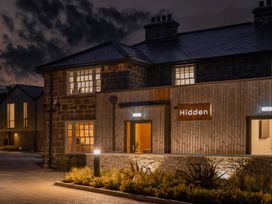 A building exterior with a sign at Hidden 19- Coastal Hot Tub in St Ives