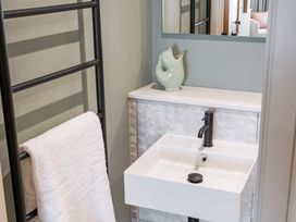 A bathroom with a sink and towel rail at tbc in St. Ives