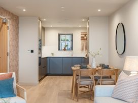 A kitchen with dining area and wall art at tbc in St. Ives
