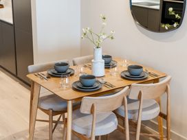 A dining room with a table set for four at tbc in St. Ives