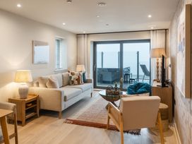 A living room with furniture and a view at tbc in St. Ives