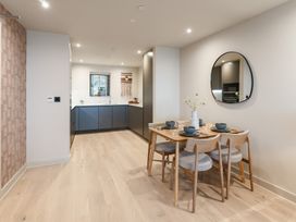 A dining room with a table and chairs at tbc in St. Ives