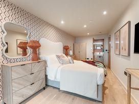 A bedroom with a bed and bedside tables at tbc, St. Ives