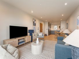 A living room with a television and sofa at tbc in St. Ives