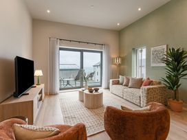 A living room with a sofa and coffee table at tbc in St. Ives